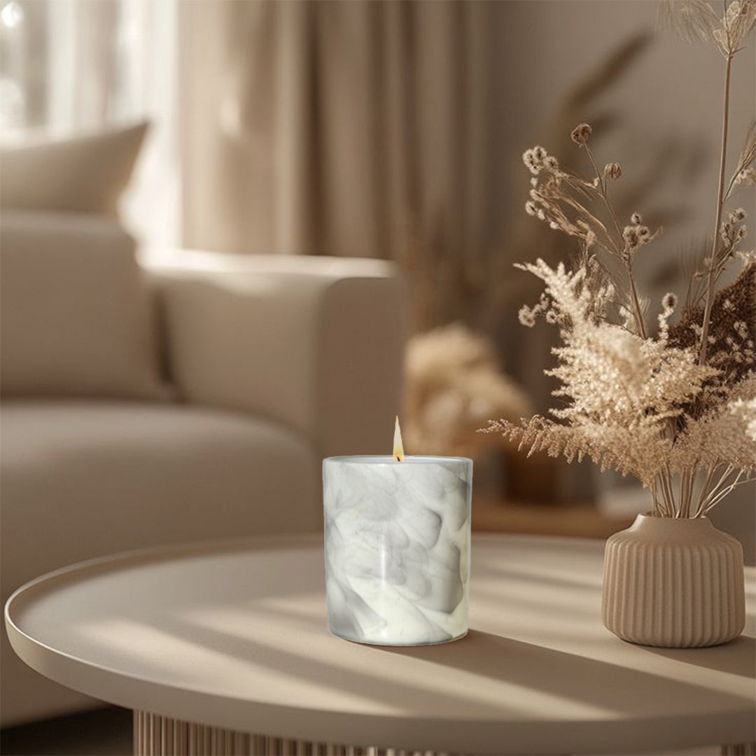 artkart Elegant Earthen Beauty Marbled Serenity Scented Candles - Lifestyle Image of artkart Elegant Earthen Beauty Marbled Serenity Scented Candles on Center Table